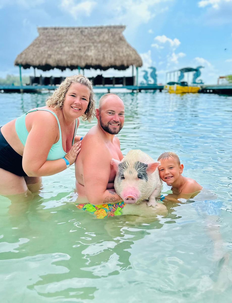 Guests with a pig and sloth at Little French Key